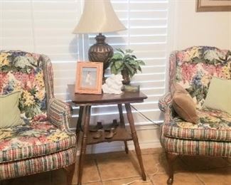 Comfortable reading nook with antique table 