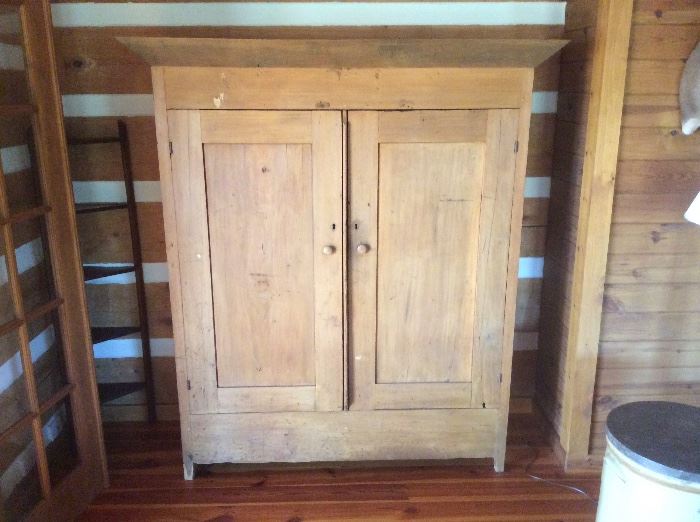 Antique chifforobe in poplar wood and walnut cornice with a yellowish milk paint wash. Found in a log home on Signal Mountain, TN  