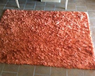 Rust colored shaggy rug. 7’6”x5’