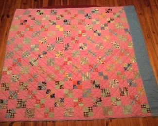 Hand stitched patchwork quilt with blue backing 74” x 66”