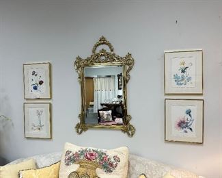 HEAVY SOLID BRASS MIRROR WITH BRASS FRAMED FLORAL PRINTS MAKES A STATEMENT.