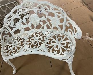 HEAVY CAST IRON BENCH THAT MATCHES THE ANTIQUE PAIR OF MATCHING TRELLISES.