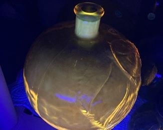 Yellow apple bottle under black light 