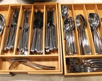 Tomodachi flatware service for 16 plus nine serving pieces.  Utensil trays included.  
