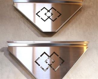 Stainless steel corner shelves.