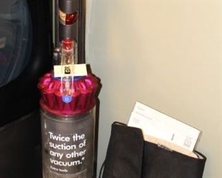 Dyson Animal vacuum with attachments.