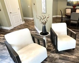 Pair of Mitchel Gold & Bob Williams chairs shown with pull up table by same designers.