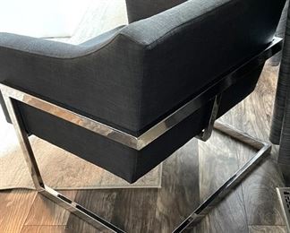 Back view of chrome based upholstered chair.