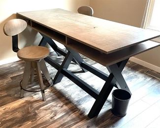 American Furniture Inc. sawhorse desk with two chairs.