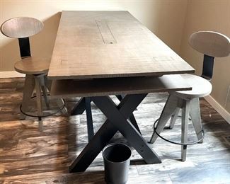 American Furniture Inc. sawhorse desk with two chairs.