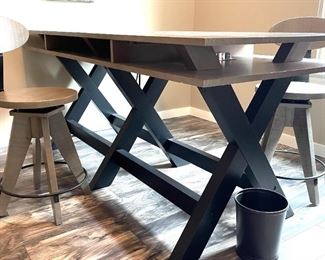 American Furniture Inc. sawhorse desk with two chairs.