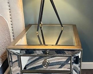 Mirrored nightstand.