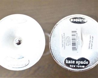 Base of Kate Spade champagne flutes.