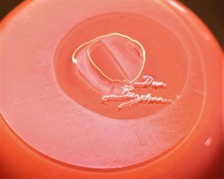 Signature on glass art bowl.