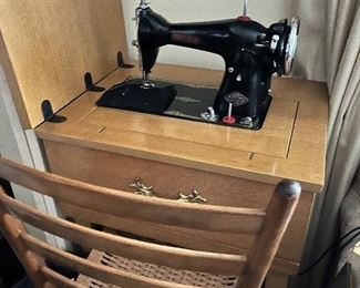 Universal sewing machine with cabinet