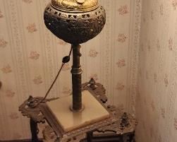 Electrified Oil lamp, with hand-painted globe with ornate metal base