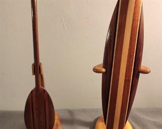 Milo Wood hand-carved paddle and surfboard, both less than 10 inches in height