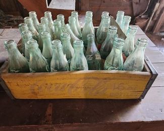 Vintage Coke bottles and crate