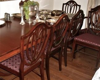 Formal dining table with shield back chairs