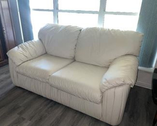 Cream colored leather loveseat needs a wipe down $195