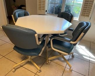 Kitchen table with four blue chairs and an extra leaf $180