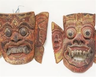 1002	2 CARVED WOOD PAINT DECORATED ASIAN MASKS, LARGEST APPROXIMATELY 11 IN X 1 1/2 IN
