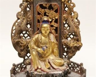 1012	INTRICATE CARVED WOOD ASIAN GILT FIGURE IN TEMPLE LIKE SETTING, APPROXIMATELY 17 IN HIGH, SOME LOSS TO CARVING
