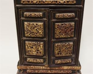 1021	ANTIQUE ASIAN CARVED & GILT DECORATED WOOD 2 DOOR TABLE TOP CABINET W/DOVETAILED CASE, APPROXIMATELY 5 IN X 12 3/4 IN X 18 1/4 IN

