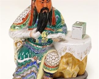 1027	ASIAN POTTERY STATUE OF SEATED MAN READING ON WOOD STAND, APPROXIMATELY 9 IN HIGH
