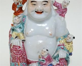1029	ASIAN POTTERY FIGURE OF A MAN SITTING, APPROXIMATELY 8 IN HIGH

