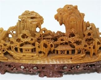 1038	CARVED SOAPSTONE VILLAGE, APPROXIMATELY 8 IN X 4 1/4 IN HIGH
