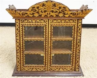 1057	ASIAN 2 DOOR CARVED GILT DECORATED CABINET W/2 INTERIOR SHELVES, APPROXIMATELY 37 IN X 13 IN X 42 IN HIGH
