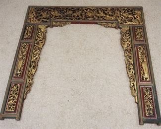 1072	LARGE CARVED GILT & PAINT DECORATED ASIAN FRAME, TOP CARVINGS 3 DIMENTIONAL, APPROXIMATELY 75 IN X 75 IN HIGH
