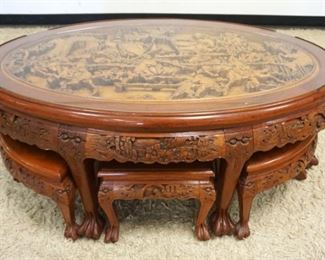 1075	OUTSTANDING DEEP CARVED OVAL ASIAN GLASS TOP TABLE W/6 BENCHES, ALL HAVING CARVED PAW FEET, APPROXIMATELY 49 IN X 31 IN X 21 IN HIGH
