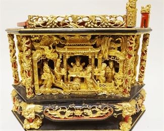 1214	ASIAN POLYCHROME & GILT WOOD CARVED DIORAMA W/3 DIMENSIONAL CARVINGS ALL AROUND, SOME LOSS TO TOP, APPROXIMATELY 9 IN X 17 IN X 14 IN HIGH
