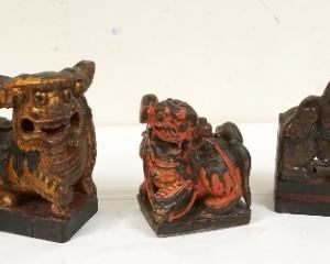 1219	LOT OF 5 CARVED FOO DOGS, LARGEST APPROXIMATELY 9 IN HIGH
