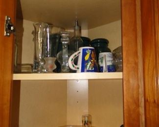Cups, mugs, and vases, along with kitchen serving pieces too