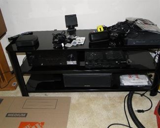 Lots of small electronics, and an amazing TV/Electronics stand