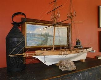 Boat model, latern, artwork and rocks, all perfectly placed