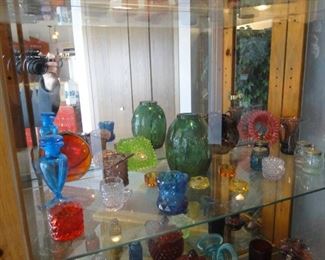 All shapes and sizes of colorful glass items