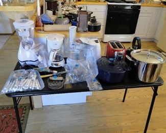 Blenders, toaster, dutch oven, large stock pot, we got it all at this sale, especially silverware too