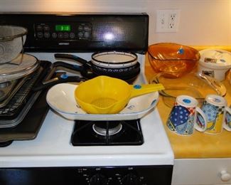 Strainer, pots and pans, and mugs too