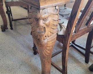 Dining room table with carved lion heads