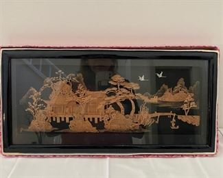 Carved wood framed scene