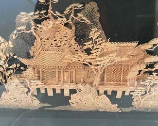 Carved wood framed scene