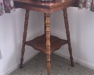 Smaller parlor table with turned legs and design on apron. The top could use a little TLC. 