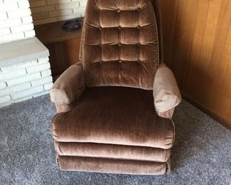 Sit back in vintage style with a velveteen swivel recliner. It has a twin, too. 