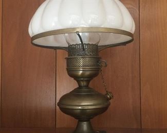 A milk glass shade tops this brass-finish accent lamp. 