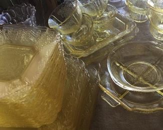Yellow Depression glass shines as it waits for its next table assignment. 
