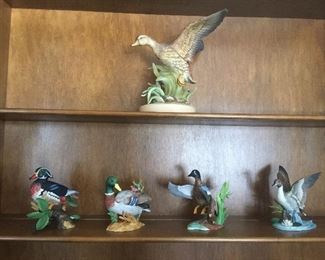 The smaller ducks are by Lenox while its bigger cousin is not marked. 